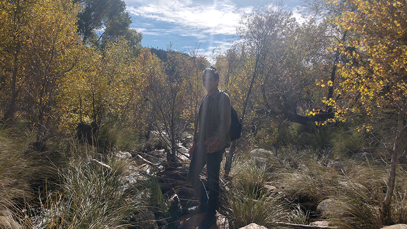 Space Grant Intern poses in front of trees at Seven Falls, AZ.