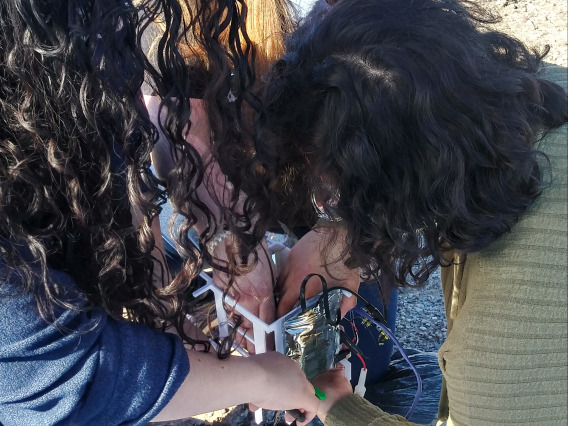 Phoenix College students working on their payload. 