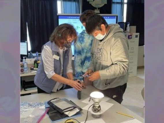 Mary Lara in classroom working with students. 