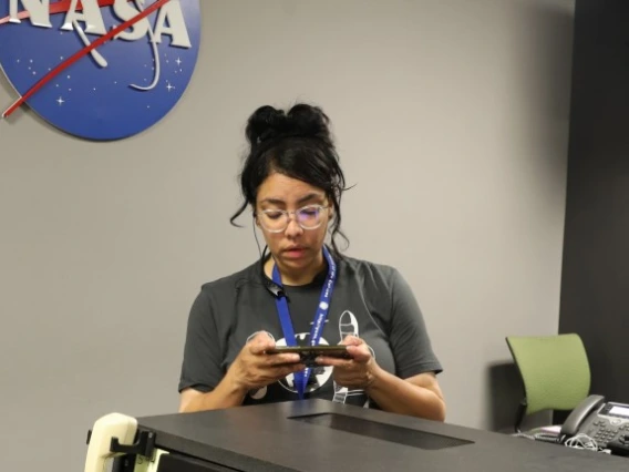 Rosemary Ferreira inside the NASA Goddard communications control room.