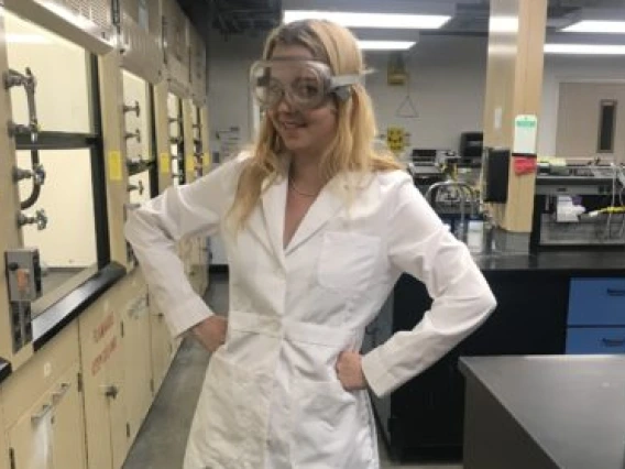 Ruby O'Brien-Metzger poses in the Superfund Dust Lab.