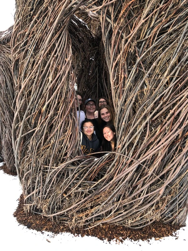 Victoria Girgis, Kathryn Tellez, Adriana Weise, Madelyn Hart, Hailey Osborn, Ariel Daniel pose inside tree art structure