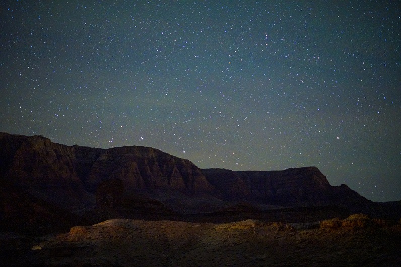 Photo by Daniel Stigmon of a meteor shooting over a cliff